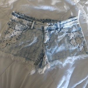 Jean shorts with a white floral lace